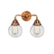 Beacon Bath Vanity Light shown in the Antique Copper finish with a Clear shade