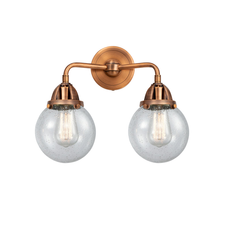 Beacon Bath Vanity Light shown in the Antique Copper finish with a Seedy shade