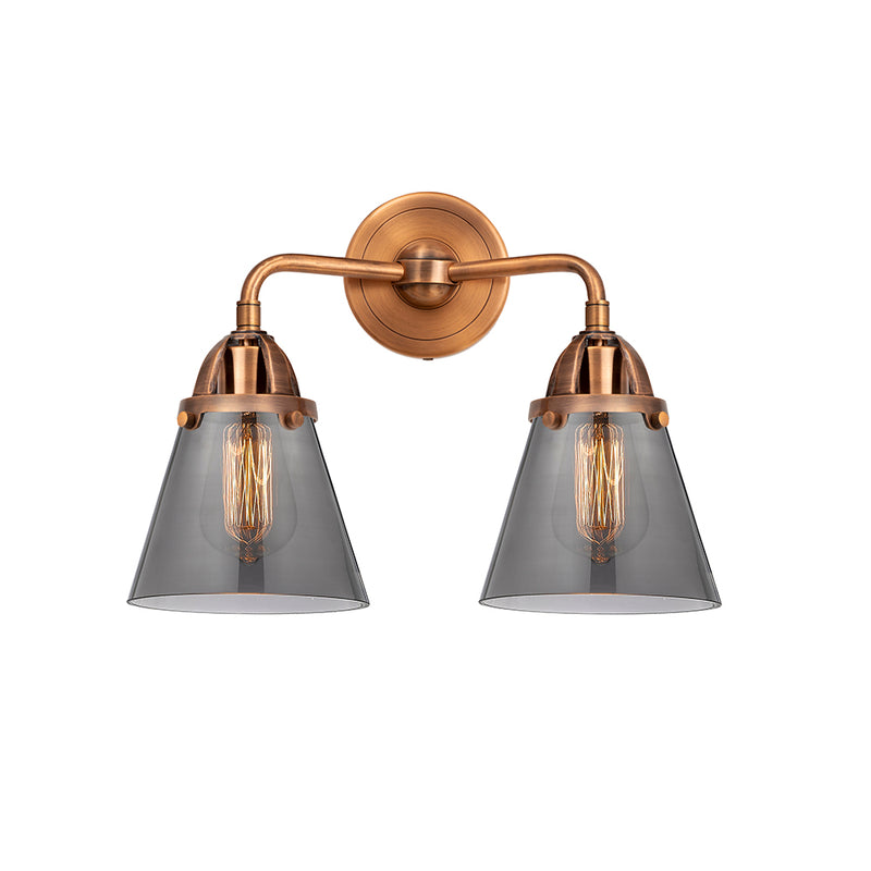 Cone Bath Vanity Light shown in the Antique Copper finish with a Plated Smoke shade