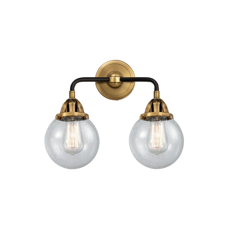 Beacon Bath Vanity Light shown in the Black Antique Brass finish with a Seedy shade