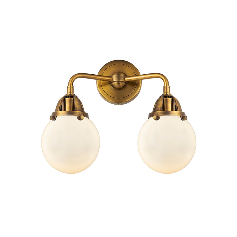 Beacon Bath Vanity Light shown in the Brushed Brass finish with a Matte White shade