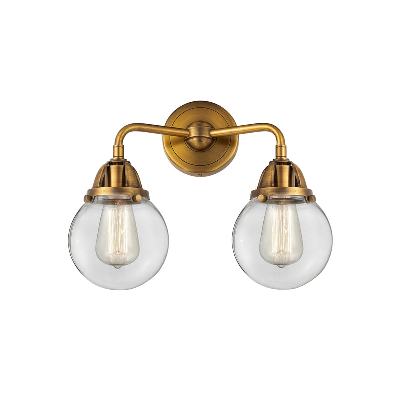 Beacon Bath Vanity Light shown in the Brushed Brass finish with a Clear shade