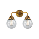 Beacon Bath Vanity Light shown in the Brushed Brass finish with a Seedy shade