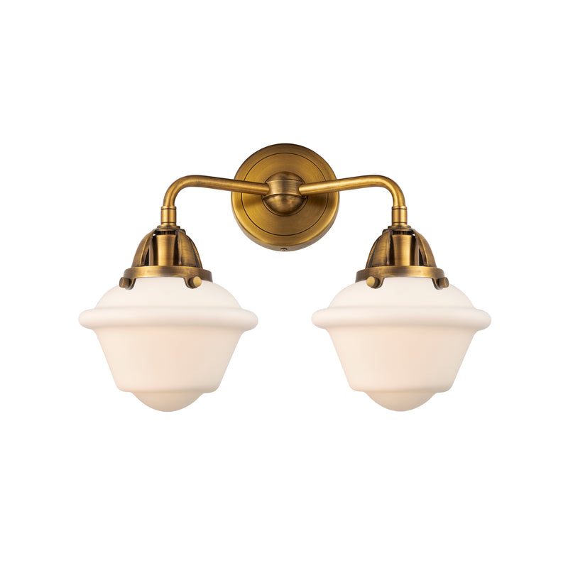 Oxford Bath Vanity Light shown in the Brushed Brass finish with a Matte White shade