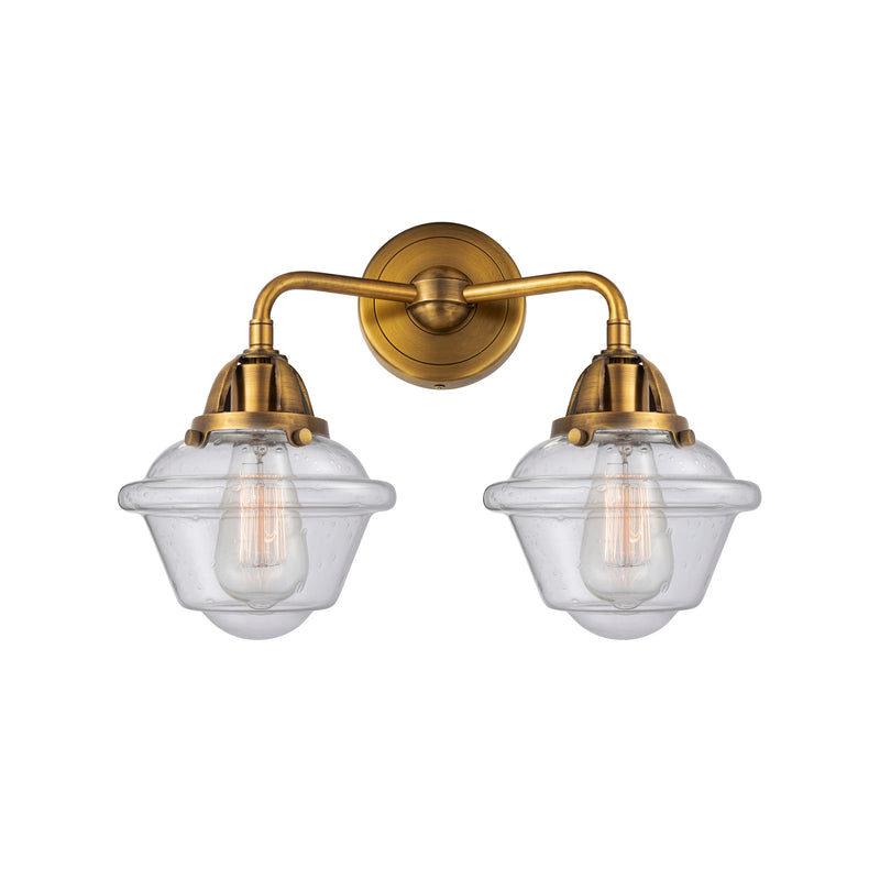 Oxford Bath Vanity Light shown in the Brushed Brass finish with a Seedy shade