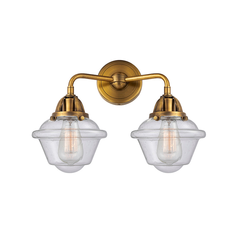 Oxford Bath Vanity Light shown in the Brushed Brass finish with a Seedy shade