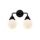 Beacon Bath Vanity Light shown in the Matte Black finish with a Matte White shade