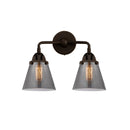 Cone Bath Vanity Light shown in the Oil Rubbed Bronze finish with a Plated Smoke shade