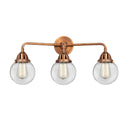 Beacon Bath Vanity Light shown in the Antique Copper finish with a Clear shade