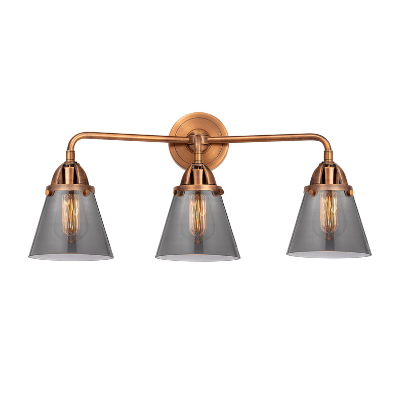 Cone Bath Vanity Light shown in the Antique Copper finish with a Plated Smoke shade