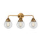 Beacon Bath Vanity Light shown in the Brushed Brass finish with a Clear shade