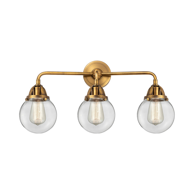 Beacon Bath Vanity Light shown in the Brushed Brass finish with a Clear shade