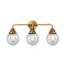 Beacon Bath Vanity Light shown in the Brushed Brass finish with a Seedy shade