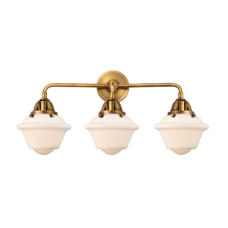 Oxford Bath Vanity Light shown in the Brushed Brass finish with a Matte White shade