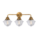 Oxford Bath Vanity Light shown in the Brushed Brass finish with a Clear shade