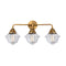 Oxford Bath Vanity Light shown in the Brushed Brass finish with a Clear shade