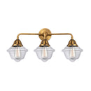 Oxford Bath Vanity Light shown in the Brushed Brass finish with a Clear shade