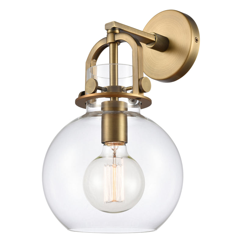 Newton Sphere Sconce shown in the Brushed Brass finish with a Clear shade