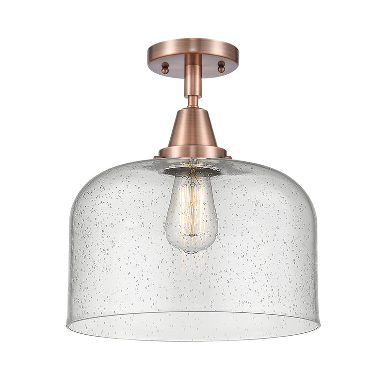 Bell Flush Mount shown in the Antique Copper finish with a Seedy shade