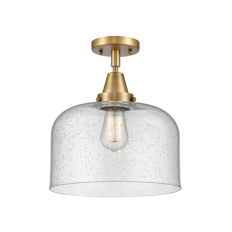 Bell Flush Mount shown in the Brushed Brass finish with a Seedy shade