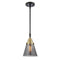 Cone Mini Pendant shown in the Black Antique Brass finish with a Plated Smoke shade