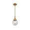 Beacon Mini Pendant shown in the Brushed Brass finish with a Seedy shade