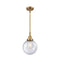 Beacon Mini Pendant shown in the Brushed Brass finish with a Seedy shade