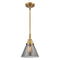 Cone Mini Pendant shown in the Brushed Brass finish with a Plated Smoke shade