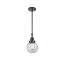 Beacon Mini Pendant shown in the Matte Black finish with a Seedy shade