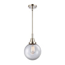 Beacon Mini Pendant shown in the Polished Nickel finish with a Clear shade