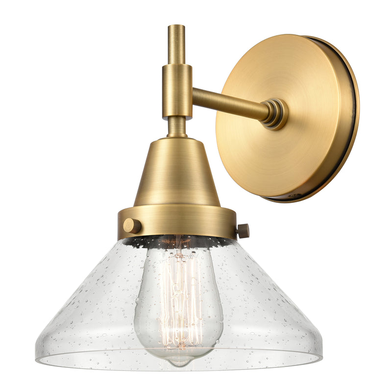 Caden Sconce shown in the Brushed Brass finish with a Seedy shade