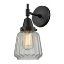 Caden Sconce shown in the Matte Black finish with a Clear shade