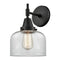 Caden Sconce shown in the Matte Black finish with a Clear shade