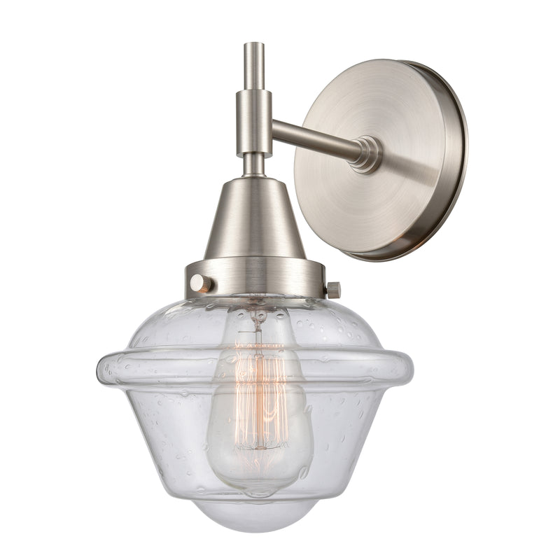 Caden Sconce shown in the Satin Nickel finish with a Seedy shade