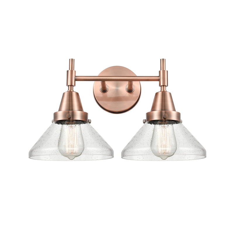 Caden Bath Vanity Light shown in the Antique Copper finish with a Seedy shade