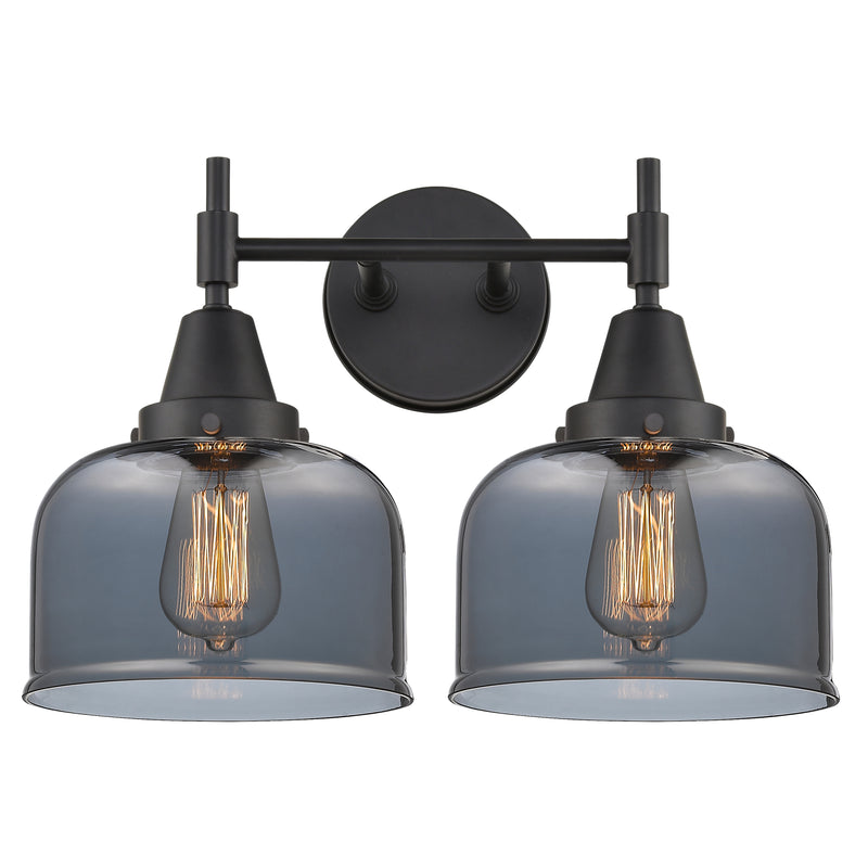 Caden Bath Vanity Light shown in the Matte Black finish with a Plated Smoke shade