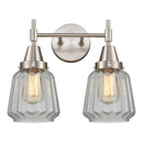 Caden Bath Vanity Light shown in the Satin Nickel finish with a Clear shade