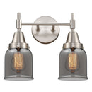 Caden Bath Vanity Light shown in the Satin Nickel finish with a Plated Smoke shade