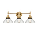 Caden Bath Vanity Light shown in the Brushed Brass finish with a Clear shade