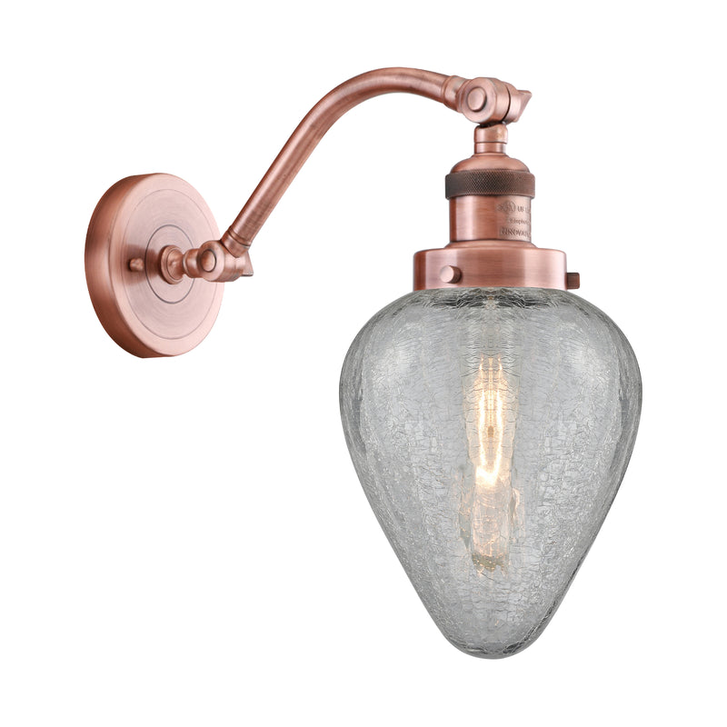 Geneseo Sconce shown in the Antique Copper finish with a Clear Crackled shade