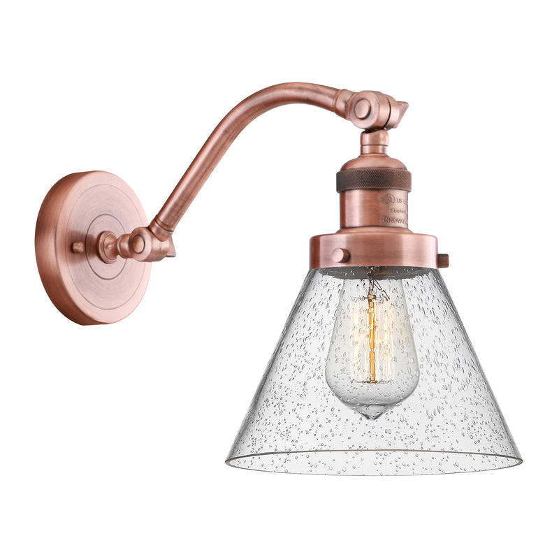 Cone Sconce shown in the Antique Copper finish with a Seedy shade