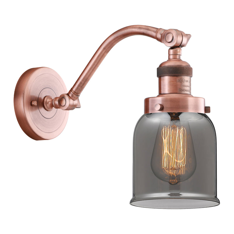 Bell Sconce shown in the Antique Copper finish with a Plated Smoke shade