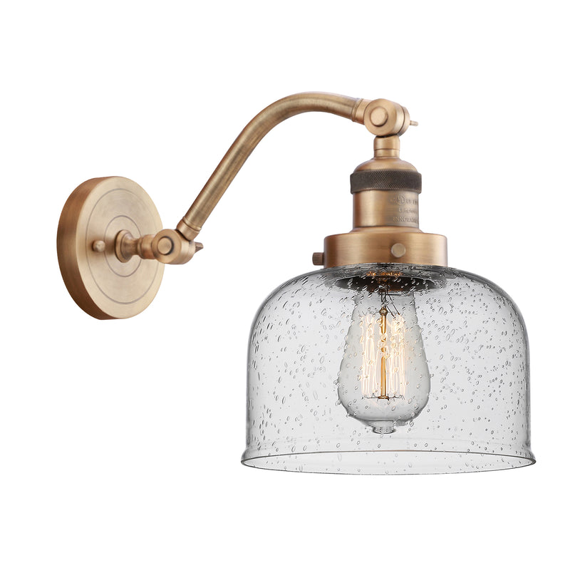 Bell Sconce shown in the Brushed Brass finish with a Seedy shade