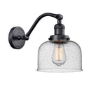 Bell Sconce shown in the Matte Black finish with a Seedy shade