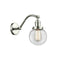 Beacon Sconce shown in the Polished Nickel finish with a Clear shade