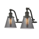 Cone Bath Vanity Light shown in the Oil Rubbed Bronze finish with a Plated Smoke shade