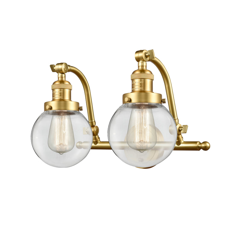 Beacon Bath Vanity Light shown in the Satin Gold finish with a Clear shade