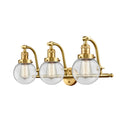 Beacon Bath Vanity Light shown in the Satin Gold finish with a Clear shade