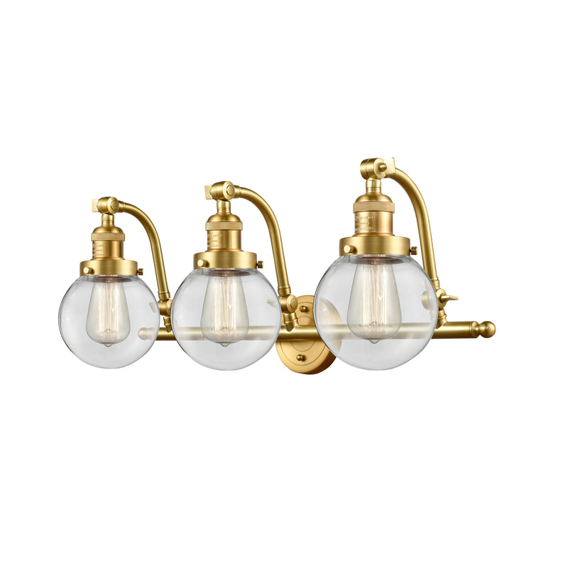 Beacon Bath Vanity Light shown in the Satin Gold finish with a Clear shade