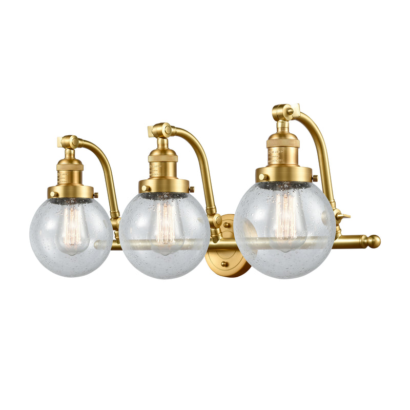 Beacon Bath Vanity Light shown in the Satin Gold finish with a Seedy shade